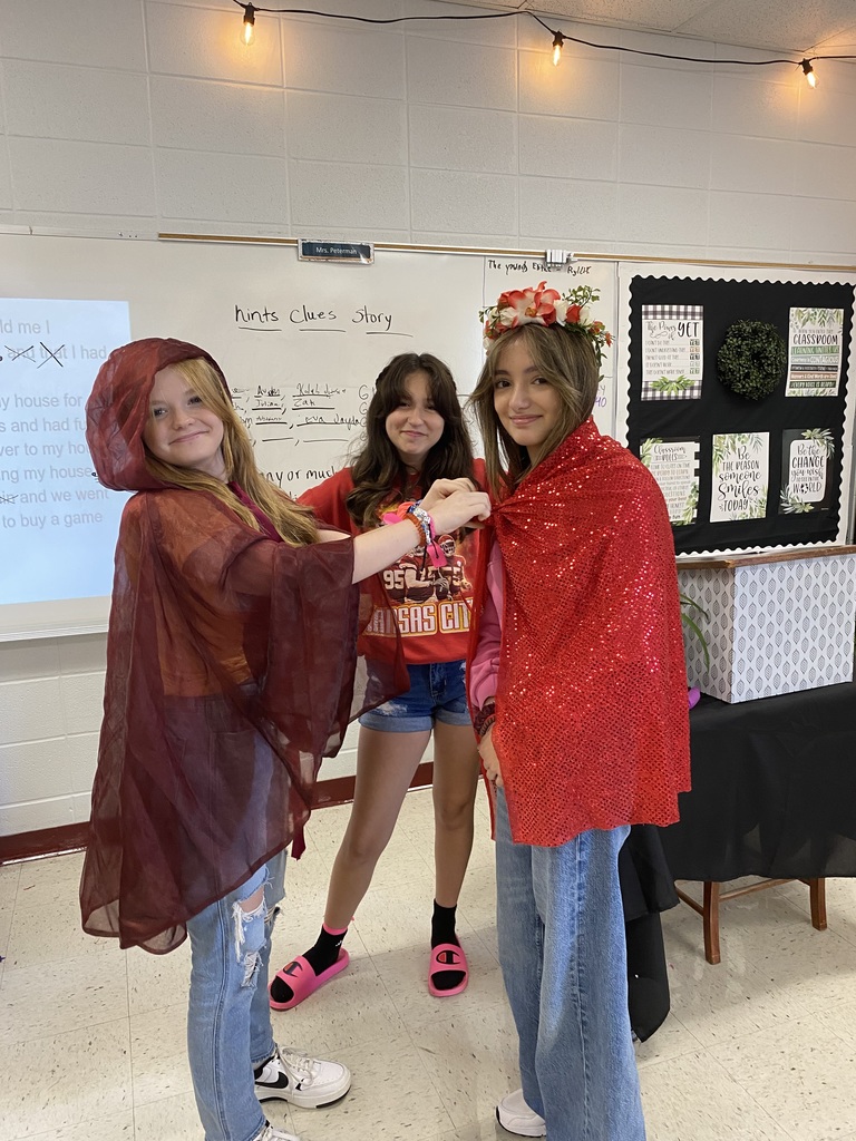 Students prepare costumes for the play. 